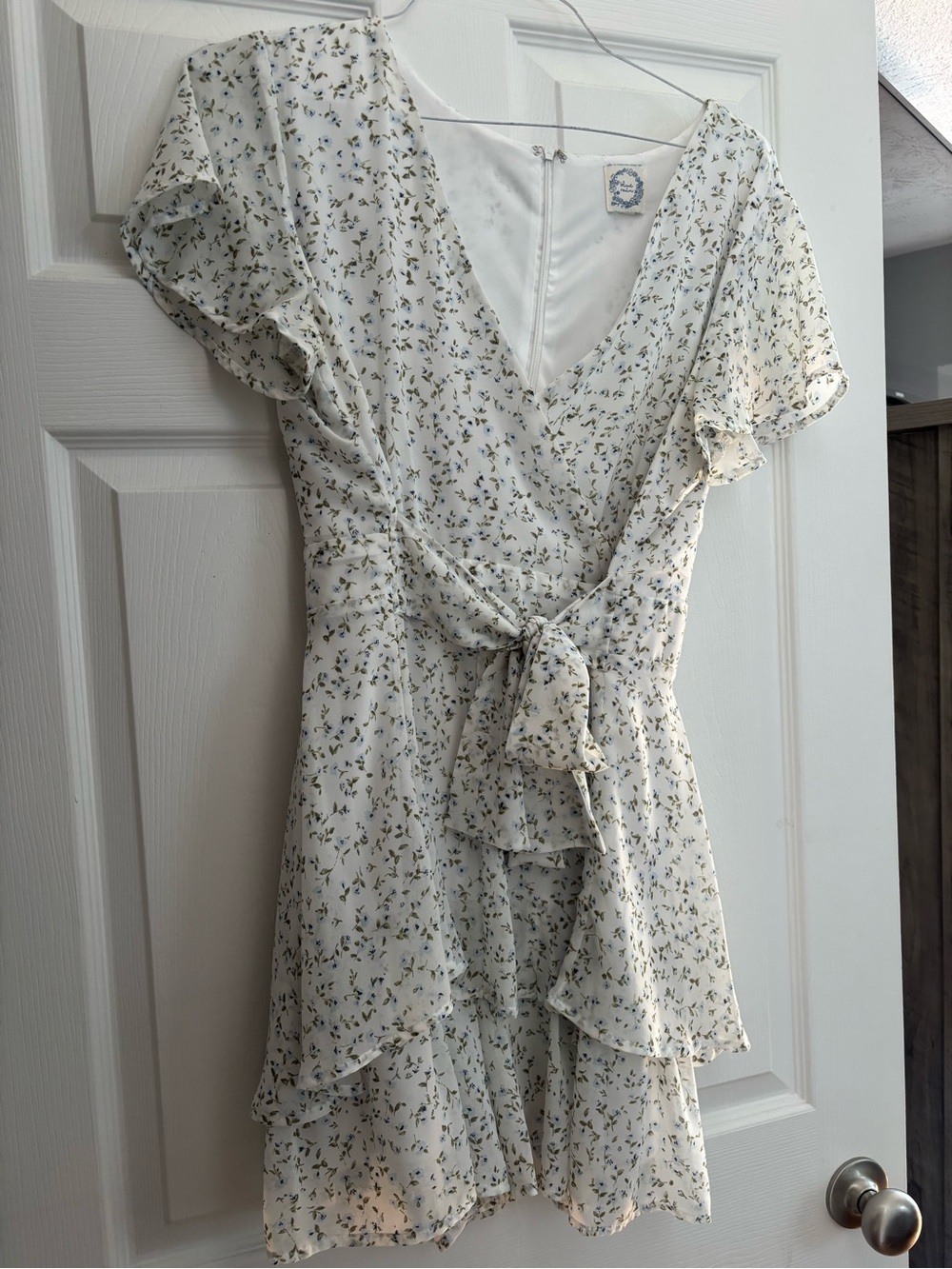 Floral V-Neck Ruffle Wrap Mini Romper in Cream